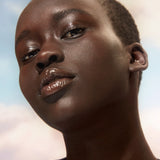 Model wearing shade 001 with a full fave of make up. For deep skin with neutral undertones